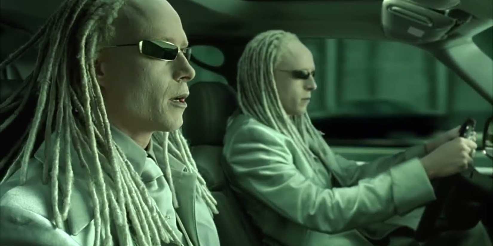 The Twins sitting in a car together in The Matrix Reloaded
