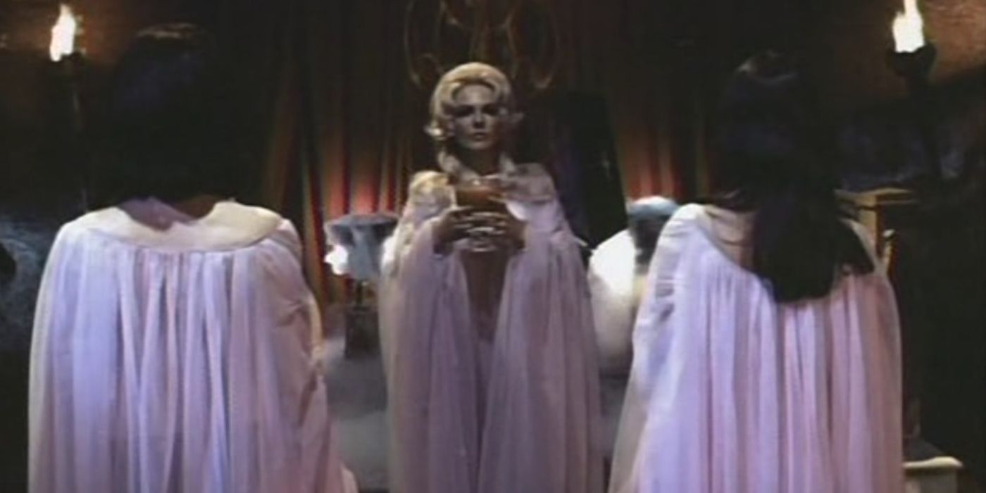 The Vampire Countess (Gina Romand) offering a glass of blood to two acolytes in The Vengeance of the Vampire Women.