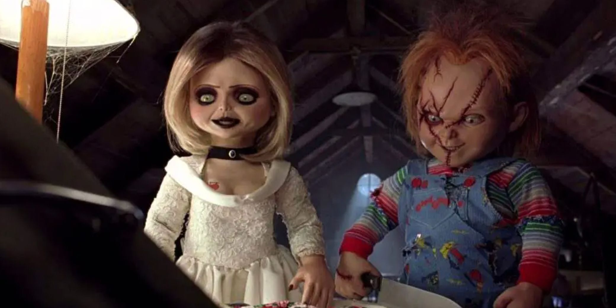 Tiffany and Chucky dolls talking to an unseen Glen doll in Seed of Chucky