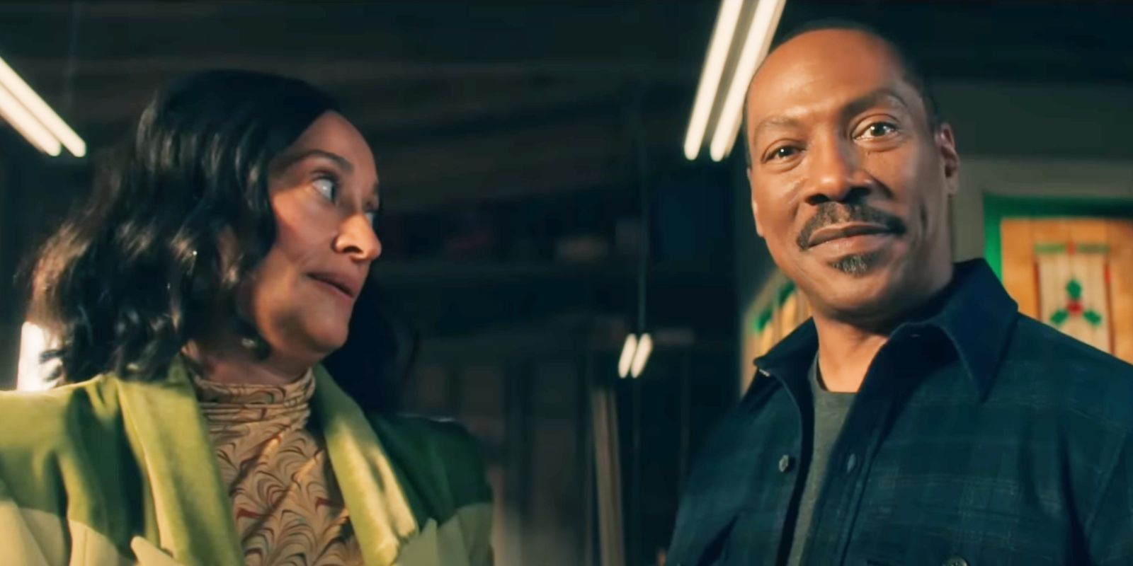 Tracey Ellis Ross' Carol looking on a smiling Eddie Murphy as Chris in Candy Cane Lane