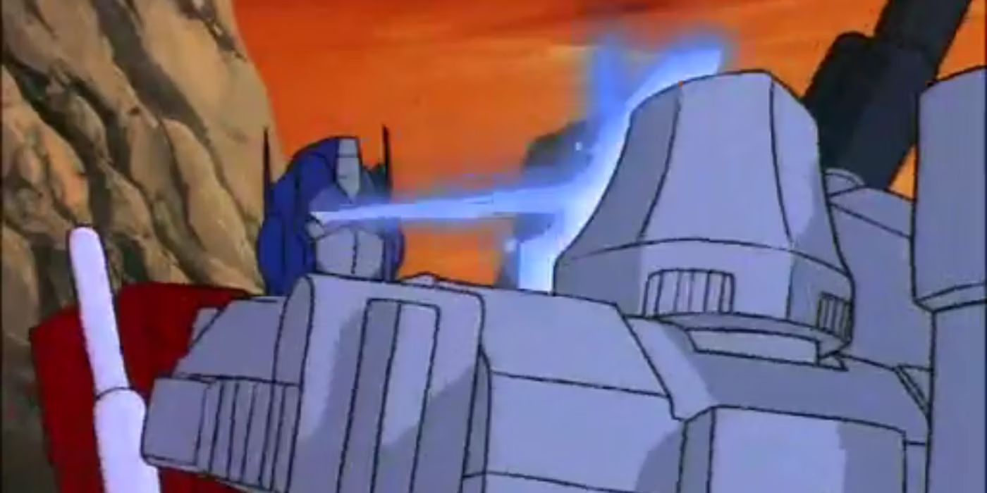Optimus blasts Megatron with his rarely used laser vision in Transformers​​​​​​​.