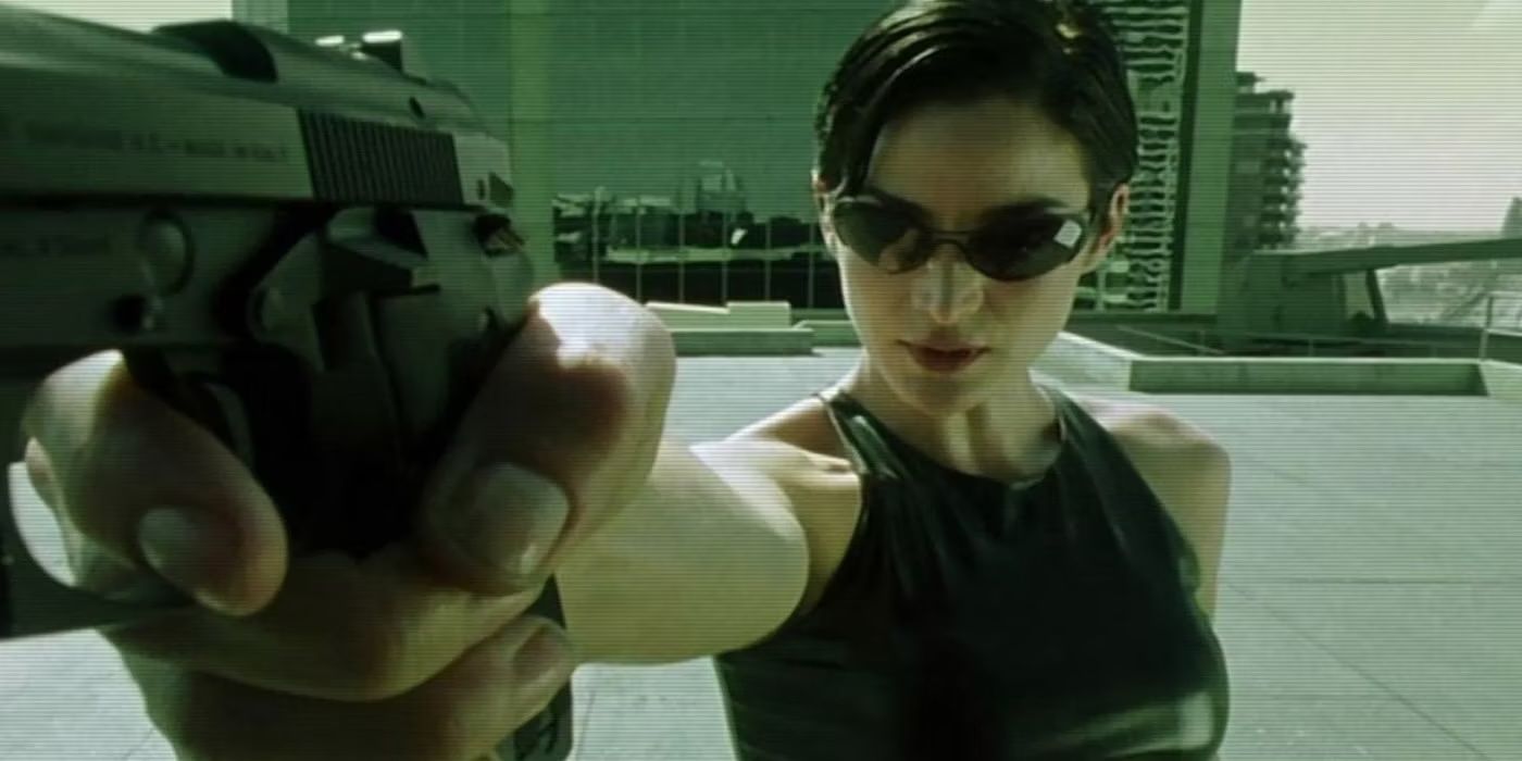 Carrie-Anne Moss as Trinity saves Neo in The Matrix.