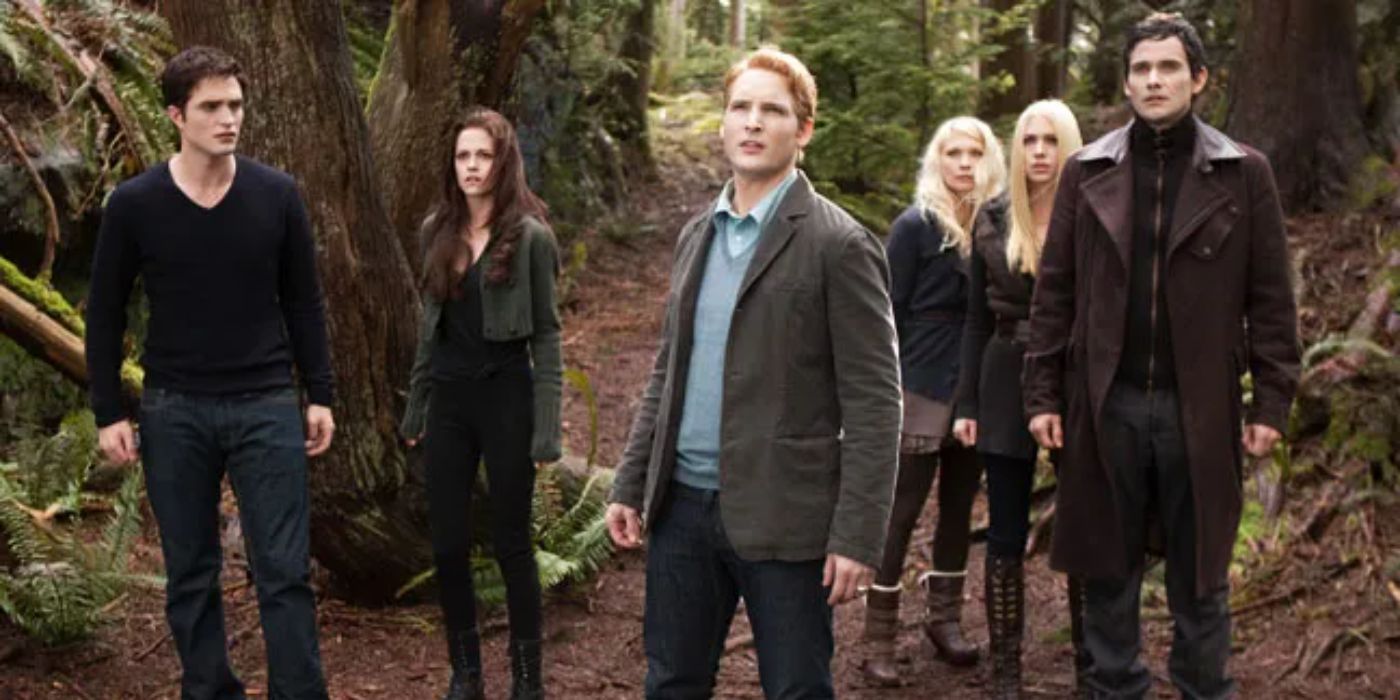 Bella and Cullens looking at something in the woods in Breaking Dawn Part 2