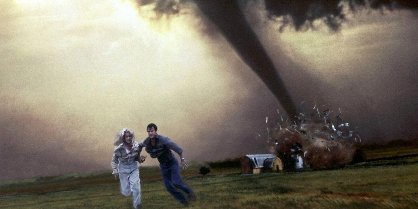 Twisters Two people running from a tornado that is destroying a house