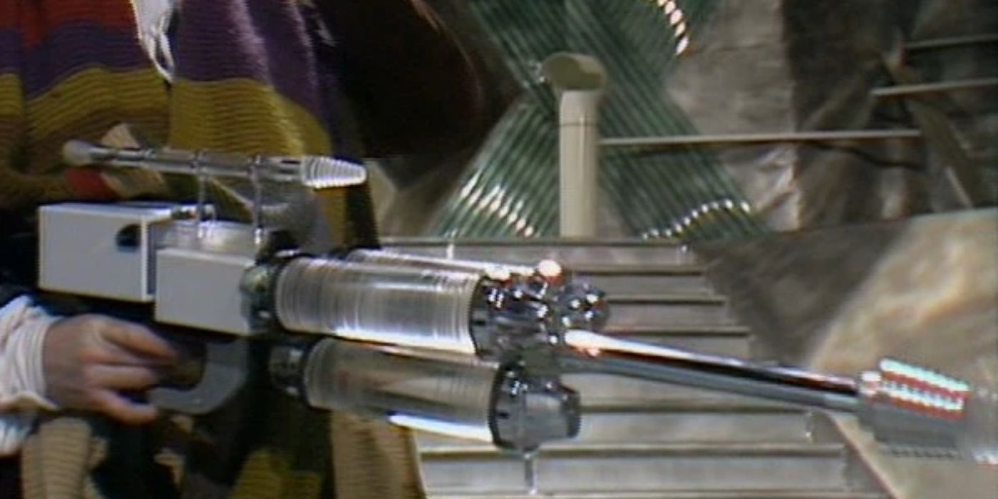 The Fourth Doctor holding the De-mat gun from the Doctor Who serial The Invasion of Time