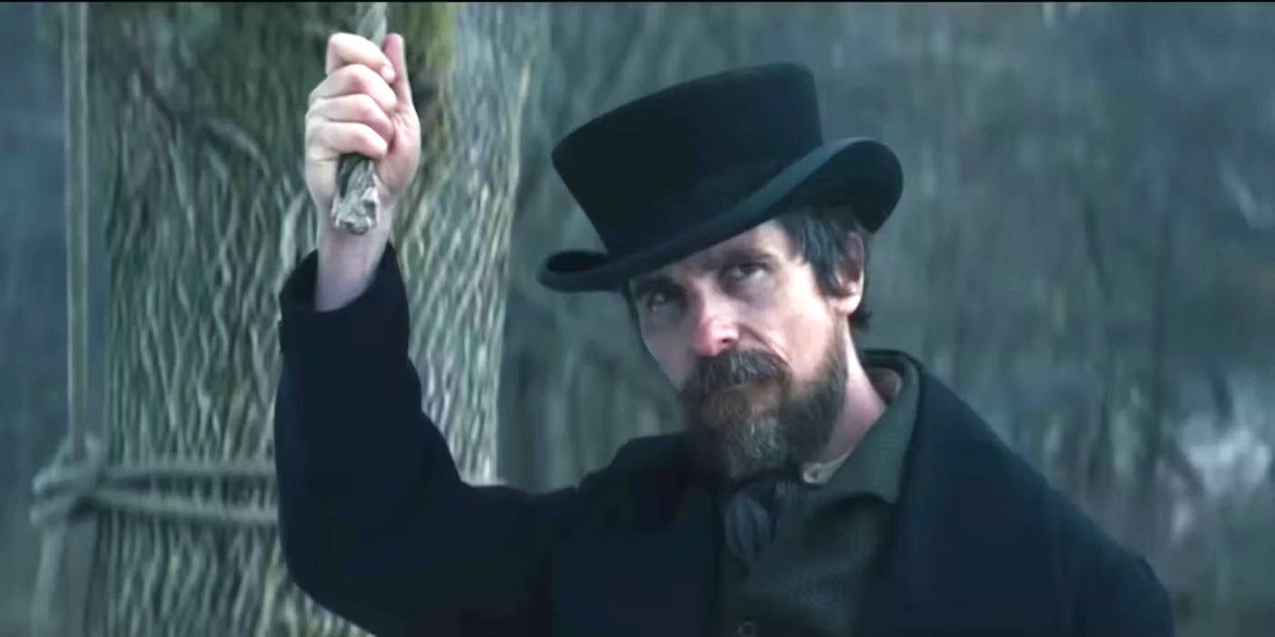 Christian Bale as Detective Landor holding a noose in The Pale Blue Eye