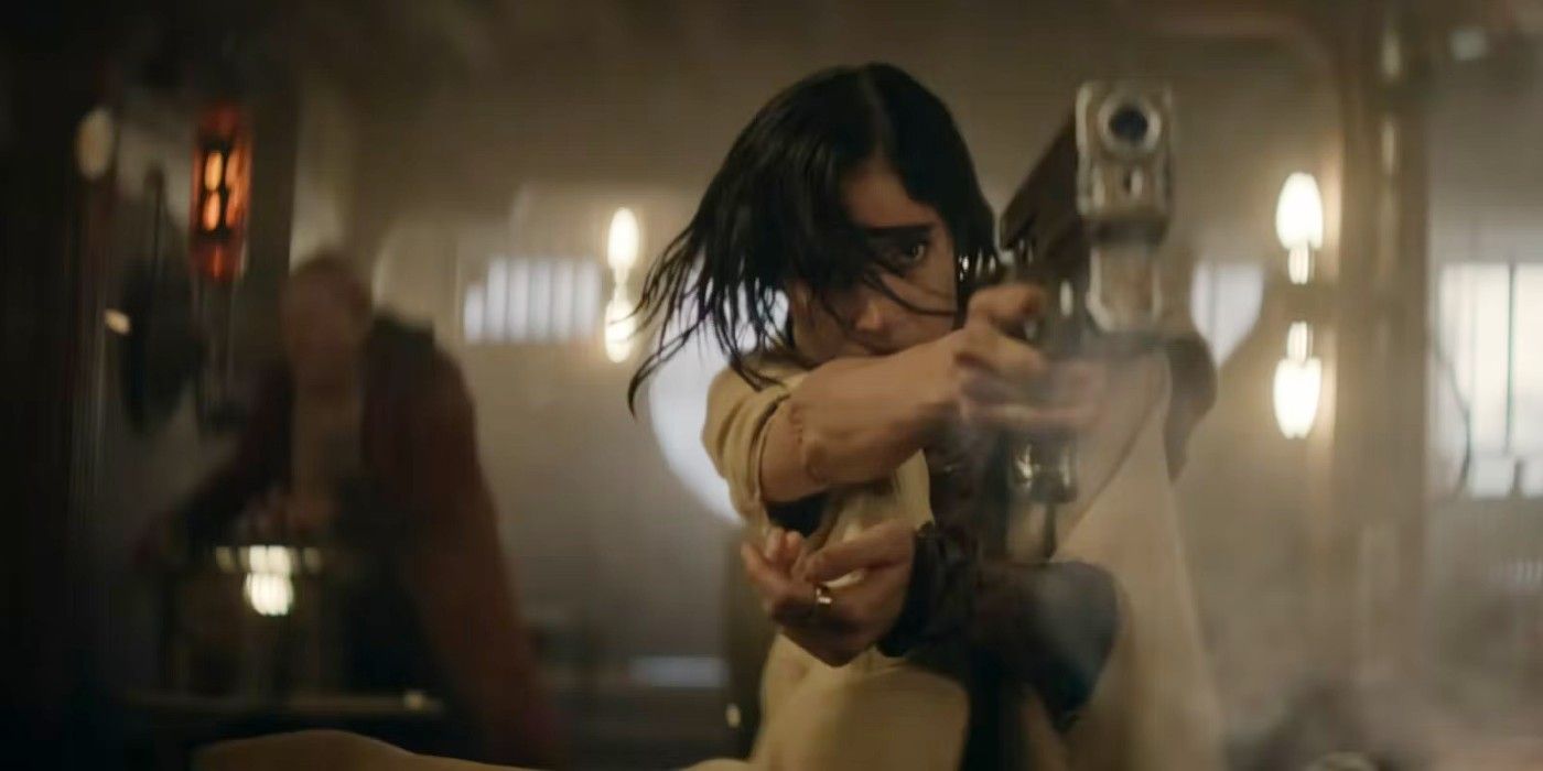 Sofia Boutella as Kora points a gun in Rebel Moon.