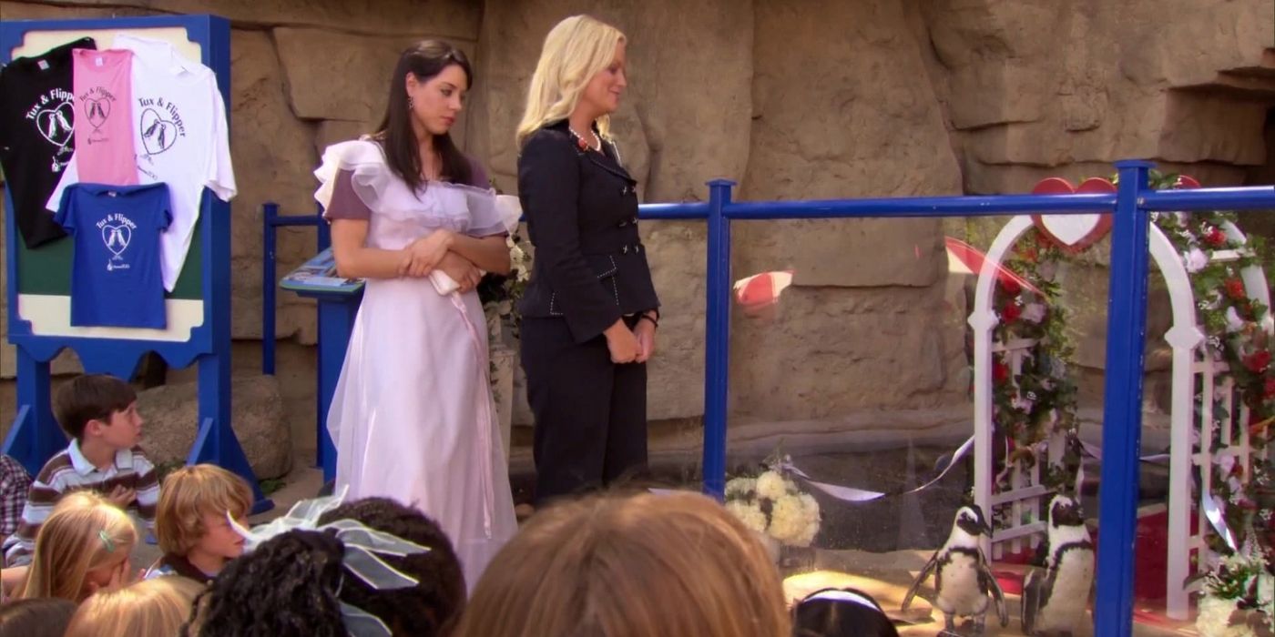 Leslie officiating a penguin wedding with April as a bridesmaid