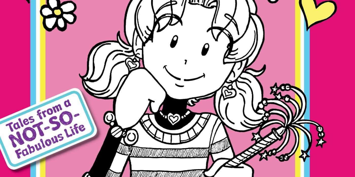 Nikki from Dork Diaries is sitting and smiling. 