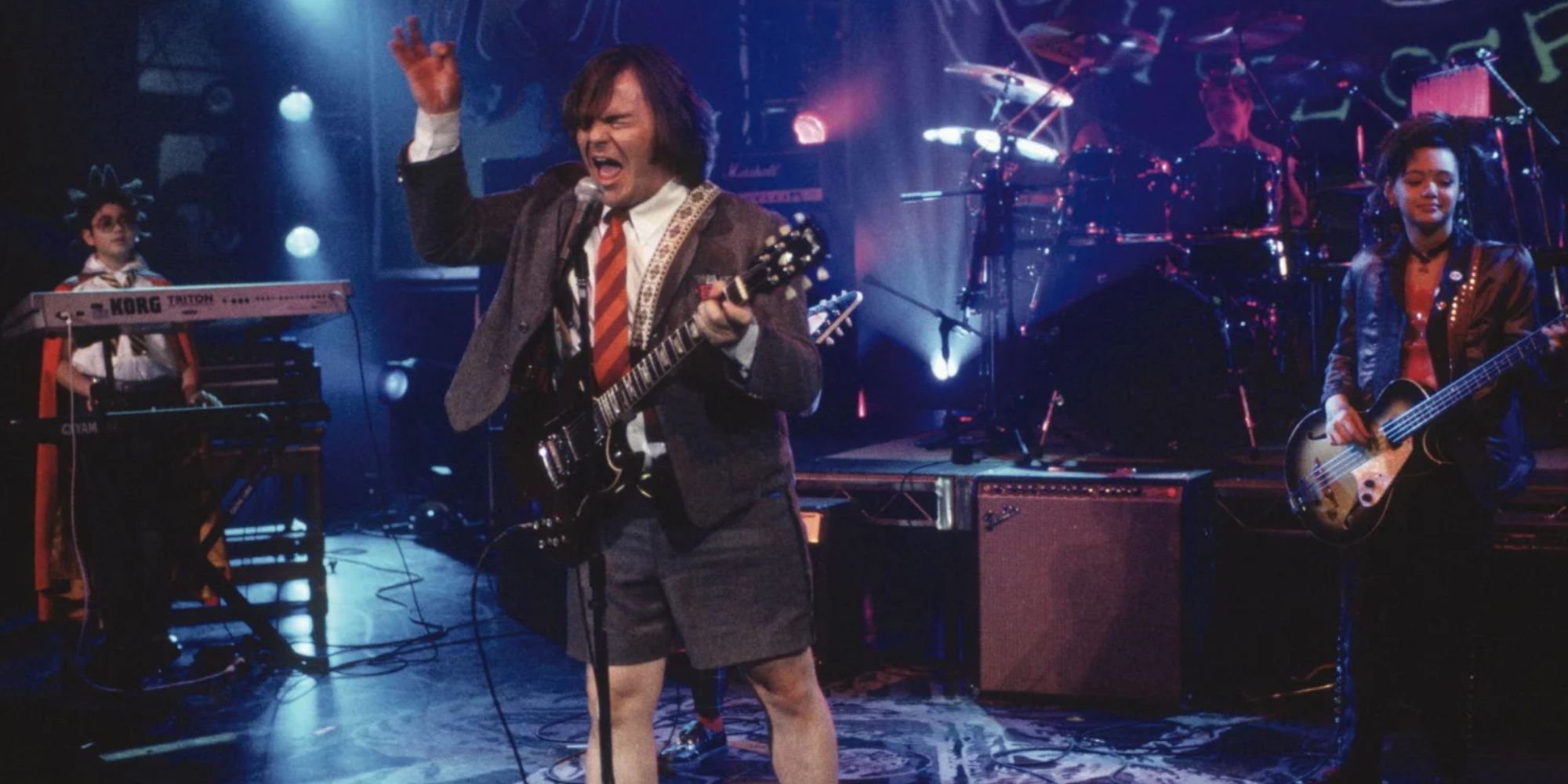 Jack Black as Dewey Finn with his student band in School of Rock