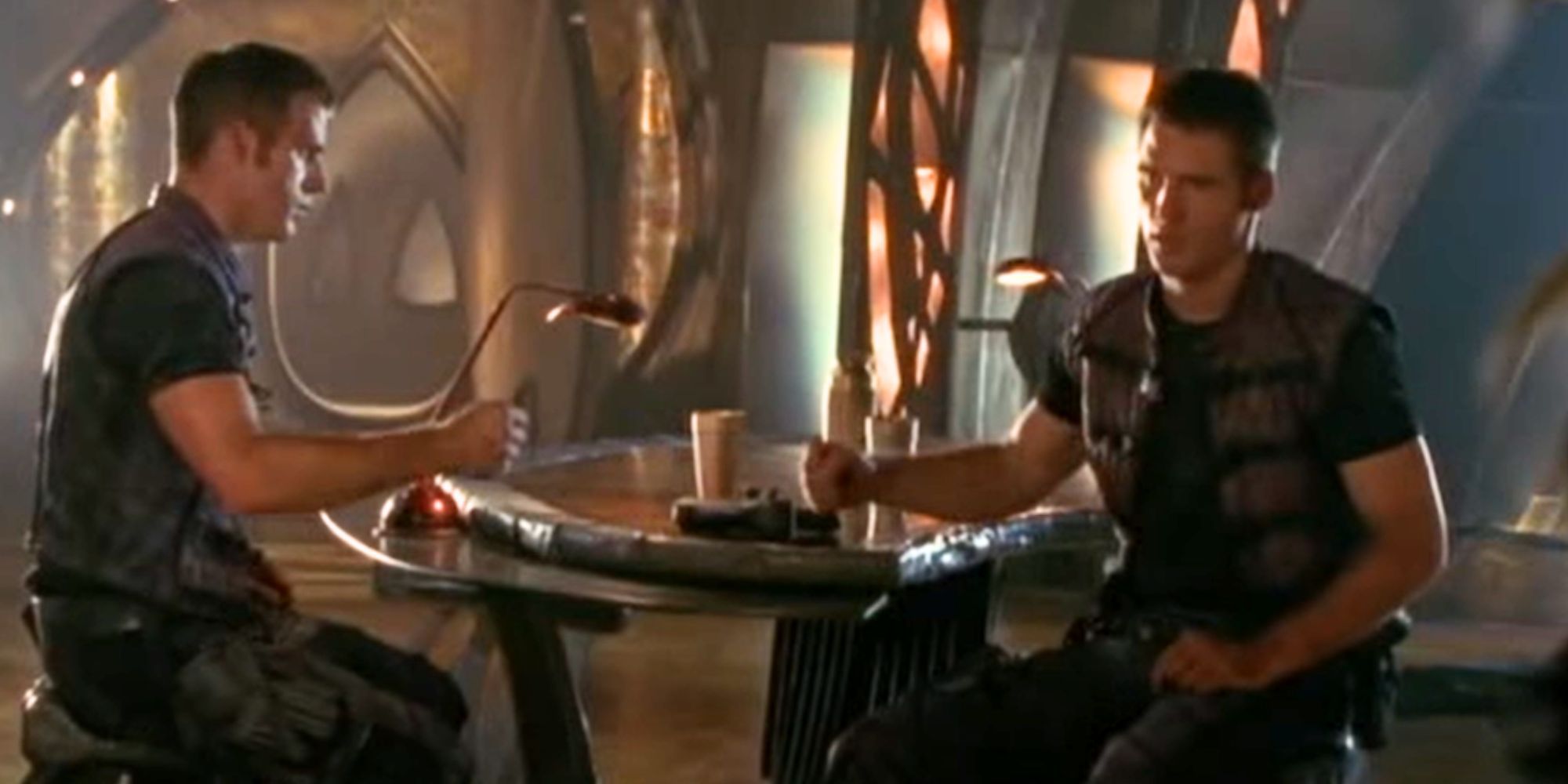 Ben Browder as two versions of John Crichton playing rock, paper, scissors in Farscape