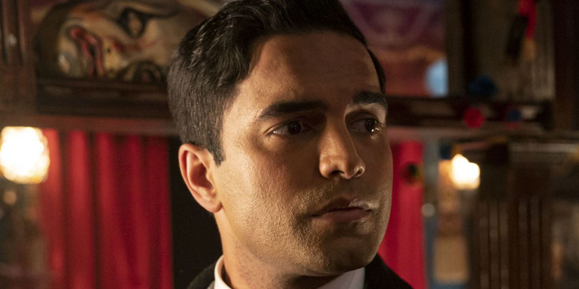 Charlie de Melo as Charlie Banerjee as the Toymaker&rsquo;s Shop in Doctor Who, and he is looking to the right looking thoughtful