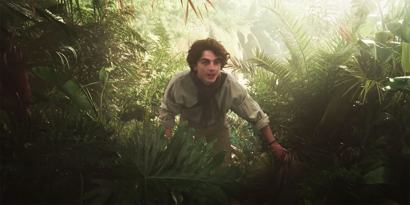 Willy Wonka (Timothee Chalamet) in the OompaLand jungle in Wonka