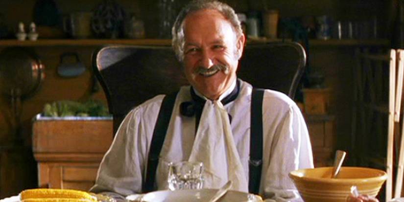 Gene Hackman as Nicholas Porter Earp happily having supper with his family in Wyatt Earp