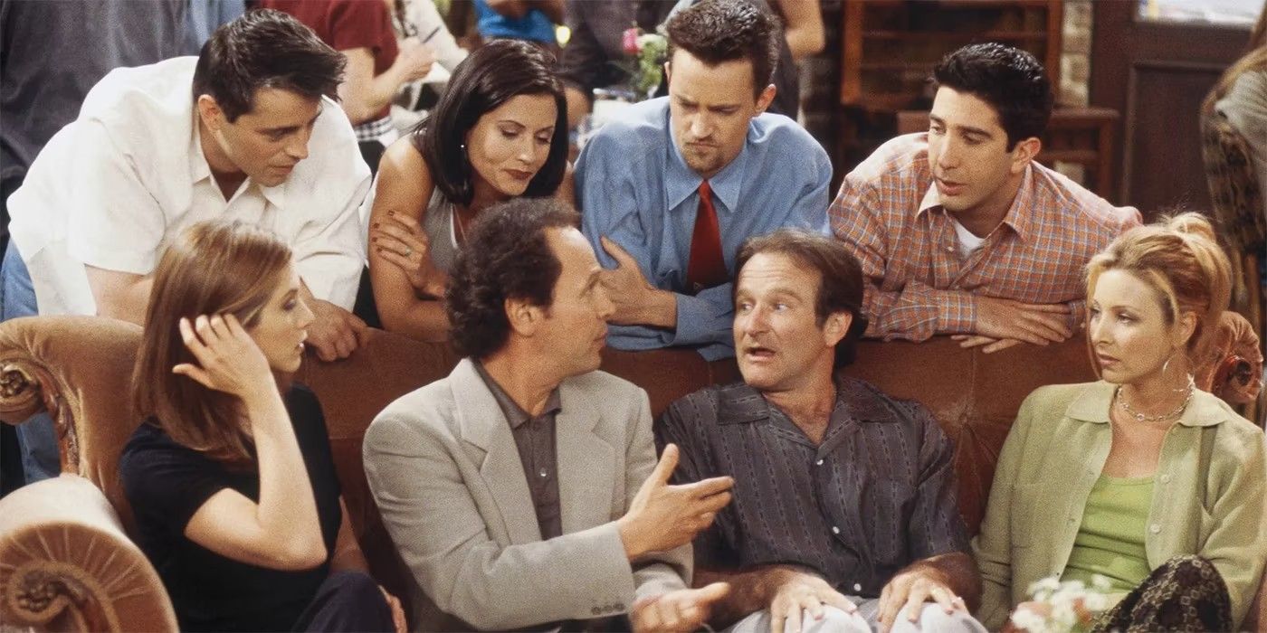 The cast of Friends gathered around Billy Crystal and Robin Williams on the couch in Central Perk