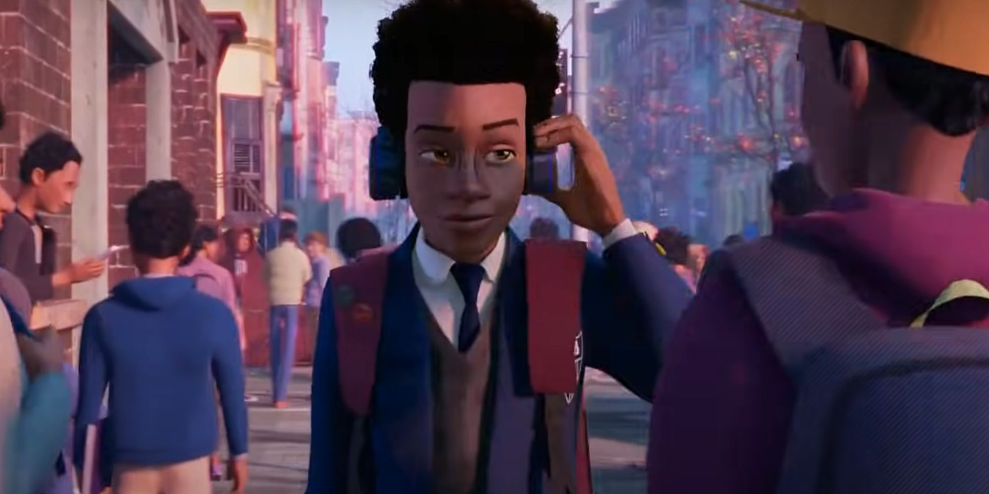 Miles Morales smiling with headphones on as he walks down the street in Spider-Man: Into the Spider-Verse