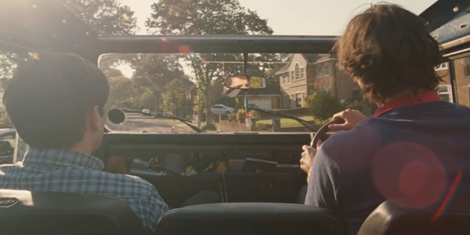 Oliver and Felix driving in a car in Saltburn