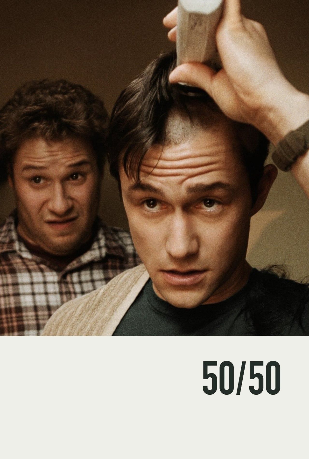 50:50 Movie Poster Showing Joseph Gordon Levitt Shaving His Head standing next to Seth Rogen