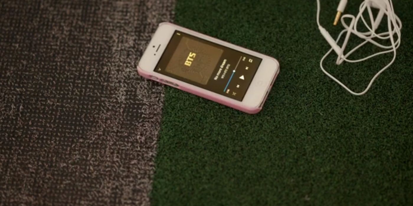 A phone playing a BTS song