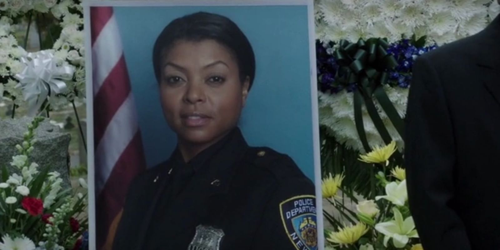 A photo of Joss Carter played by Taraji P Henson at the characters funeral in Person of Interest