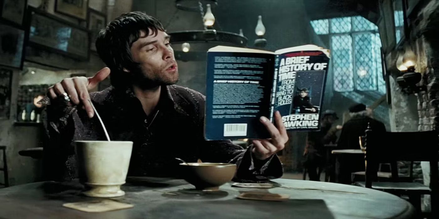 A wizard reading Stephen Hawking's A Brief History of Time in a Harry Potter movie.