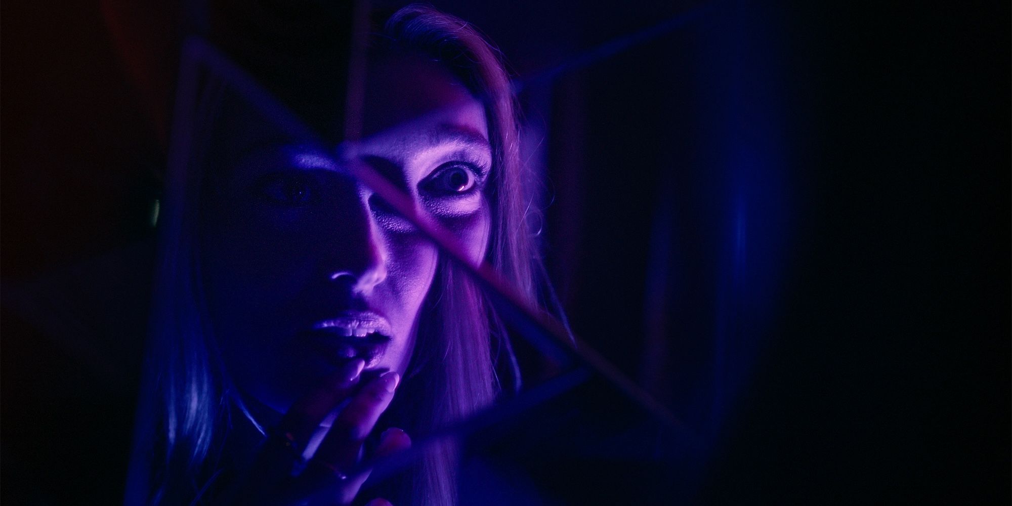 Alycia Debnam-Carey stares into a broken mirror in It's What's Inside