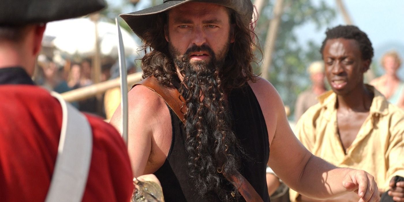 Angus Macfadyen as Blackbeard pointing a sword in the Hallmark mini series