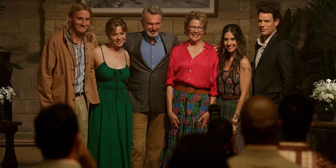 Apples Never Fall cast with their arms around each other in front of a crowd