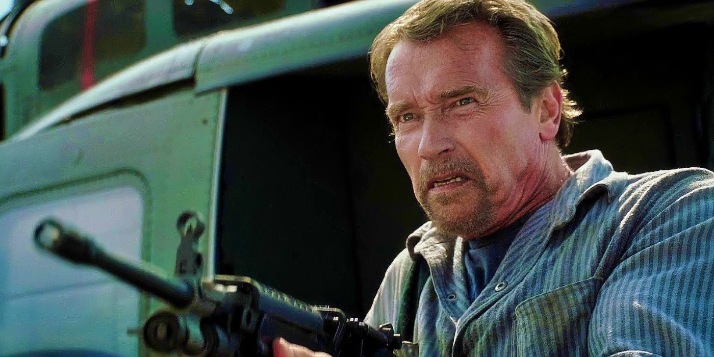 Arnold Schwarzenegger as Rottmayer firing a large machine gun in Escape Plan