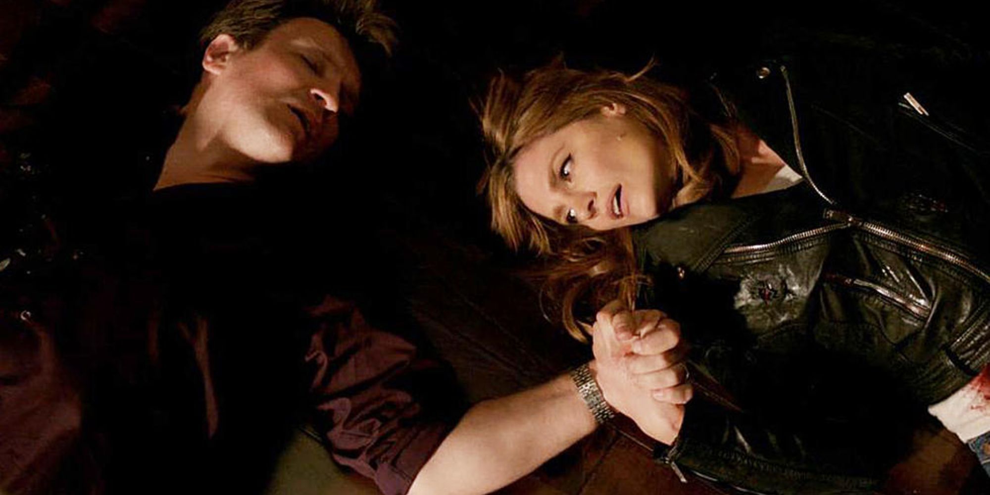 Beckett (Stana Katic) and Castle (Nathan Fillion) laying on the ground after being shot in Castle.