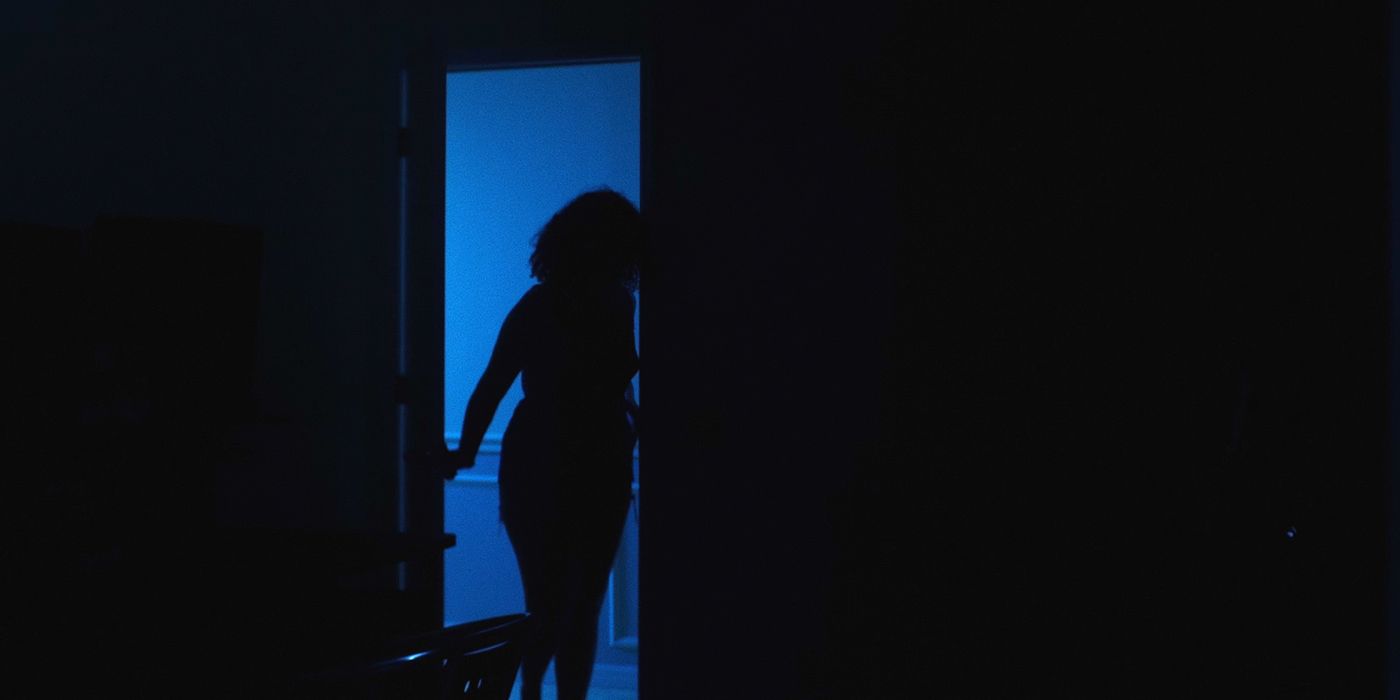 Blaine Morris as Anne investigating a room in Dark Obsession