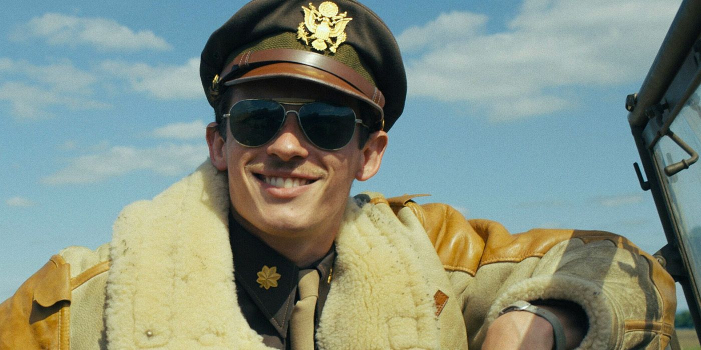 Callum Turner as John Bucky Egann Masters with sunglasses smiling in Masters of the Air