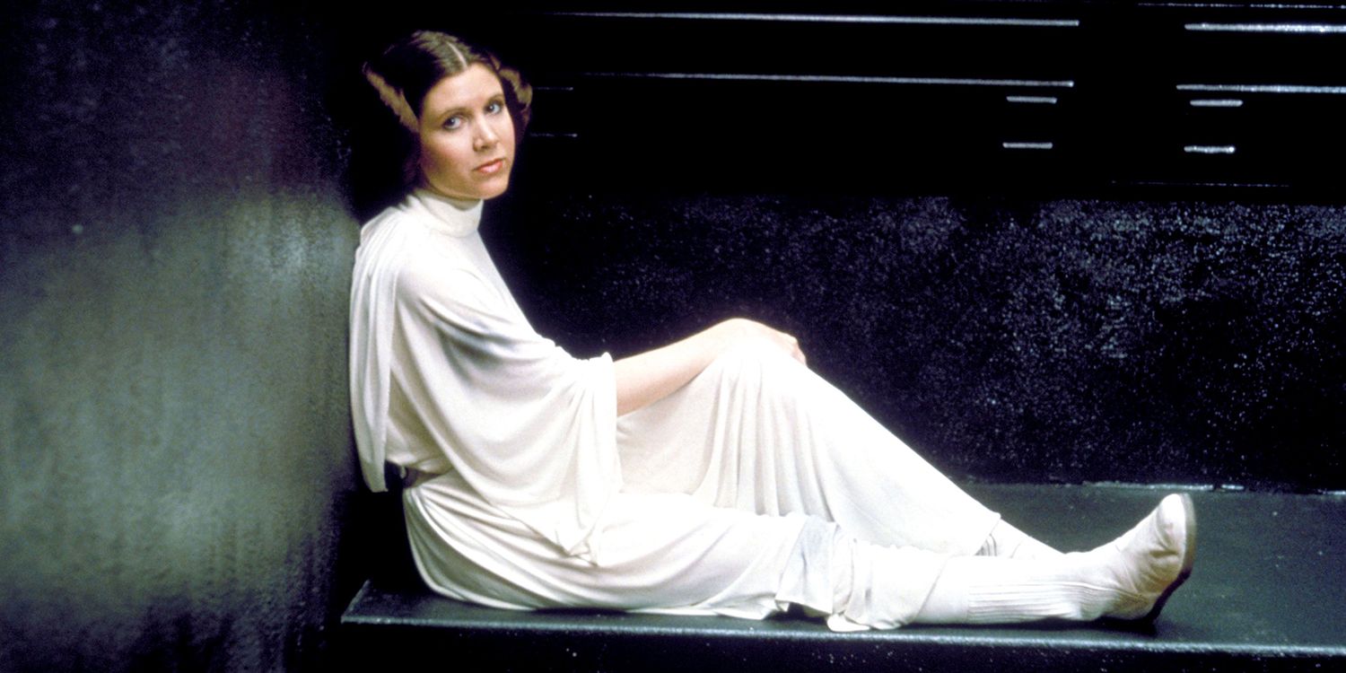 Carrie Fisher as Princess Leia looks at the camera in a promotional bts image for A New Hope