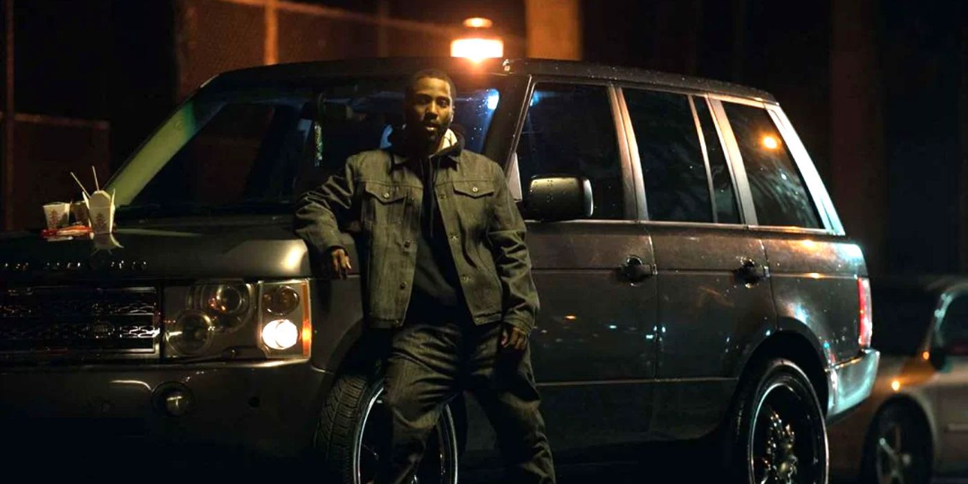 Bobo from Monster leaning against an SUV