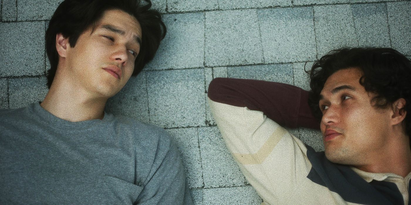 Charles Melton as Joe lying on the roof in May December