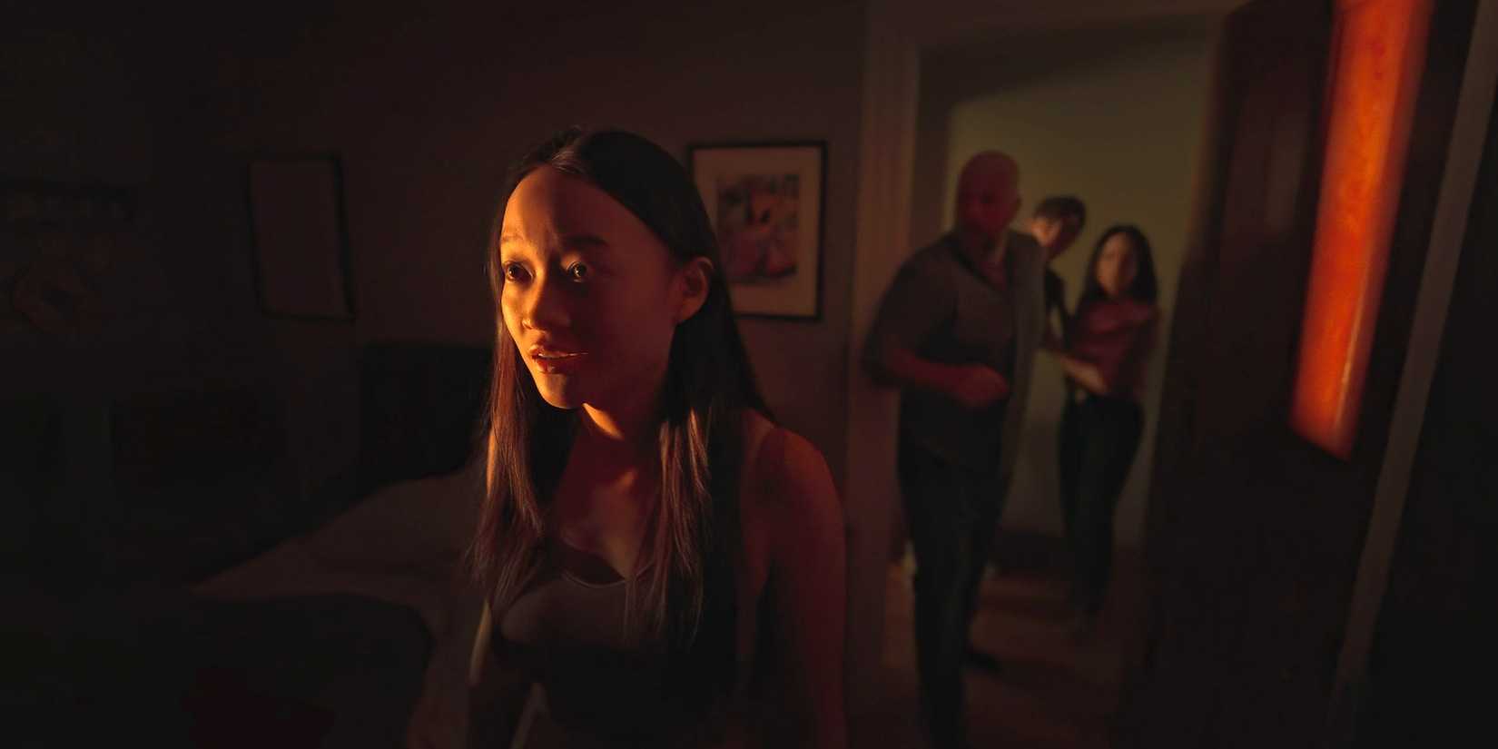 Chloe stares fearfully at the presence haunting the house in Presence