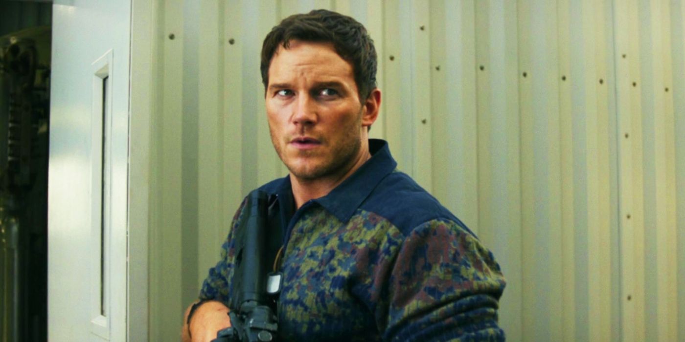 Chris Pratt as Dan Forester looking around with a gun in The Tomorrow War.
