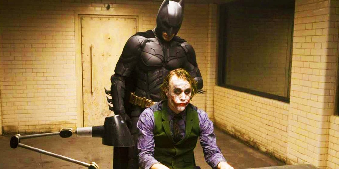 Christian Bale's Batman with Heath Ledger's Joker in an interrogation room in The Dark Knight