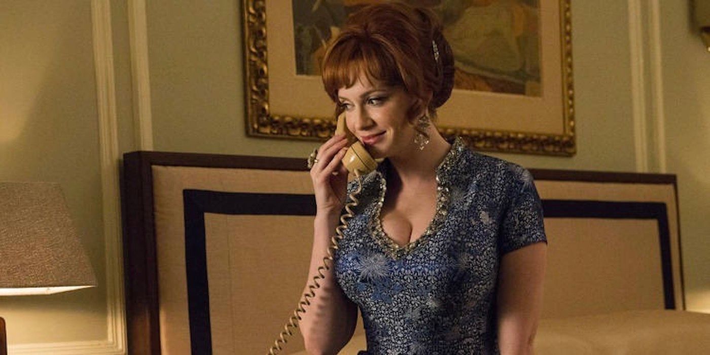 Joan Holloway sitting on the edge of the bed while speaking on the phone