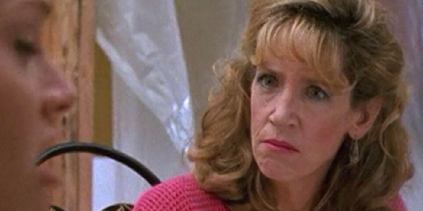 Cookie Kelly (Ann Dowd) looking furious at a dinner table in Freaks and Geeks.