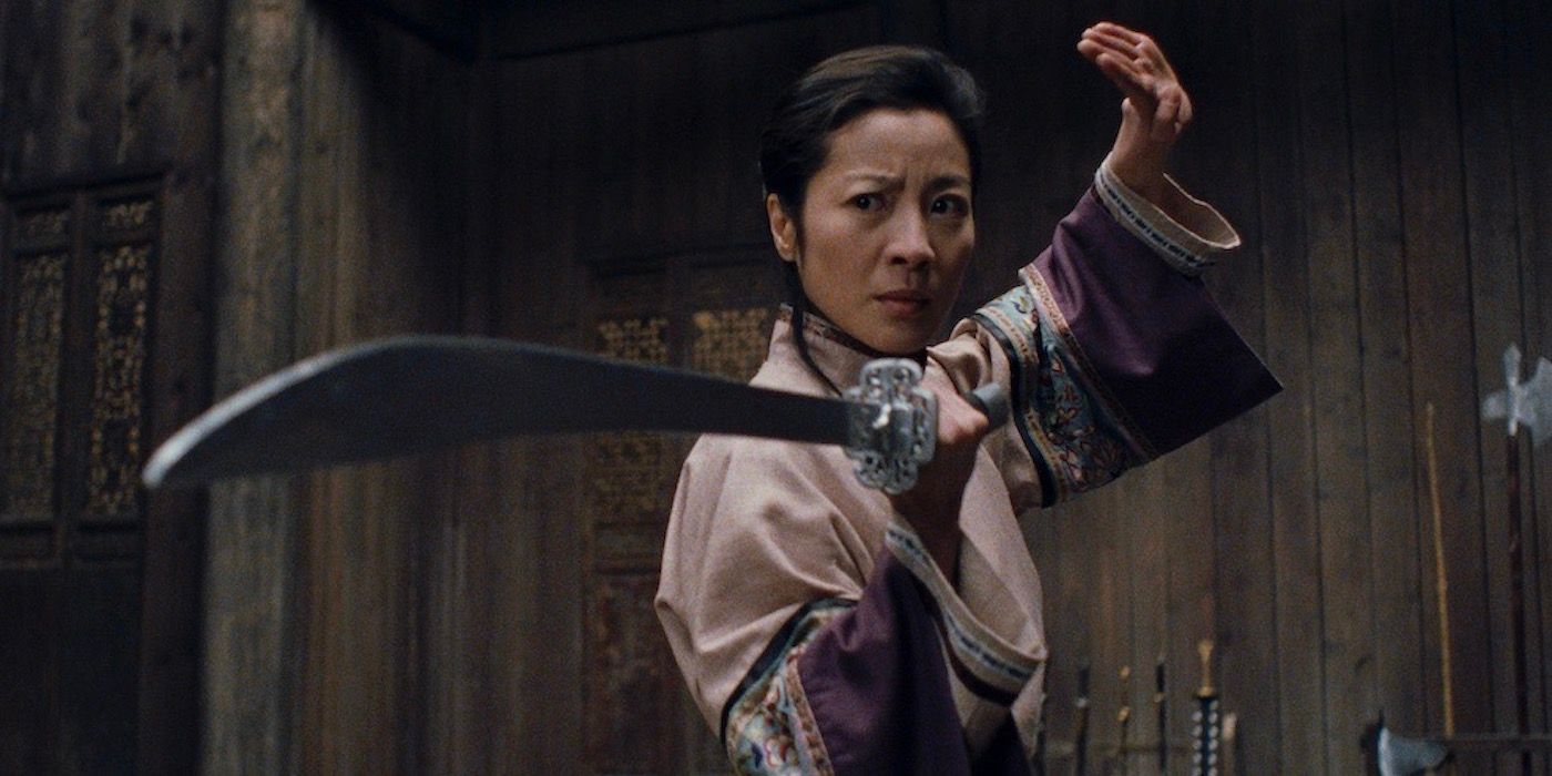 Michelle Yeoh as Yu Shu Lien holding out a sword in Crouching Tiger, Hidden Dragon