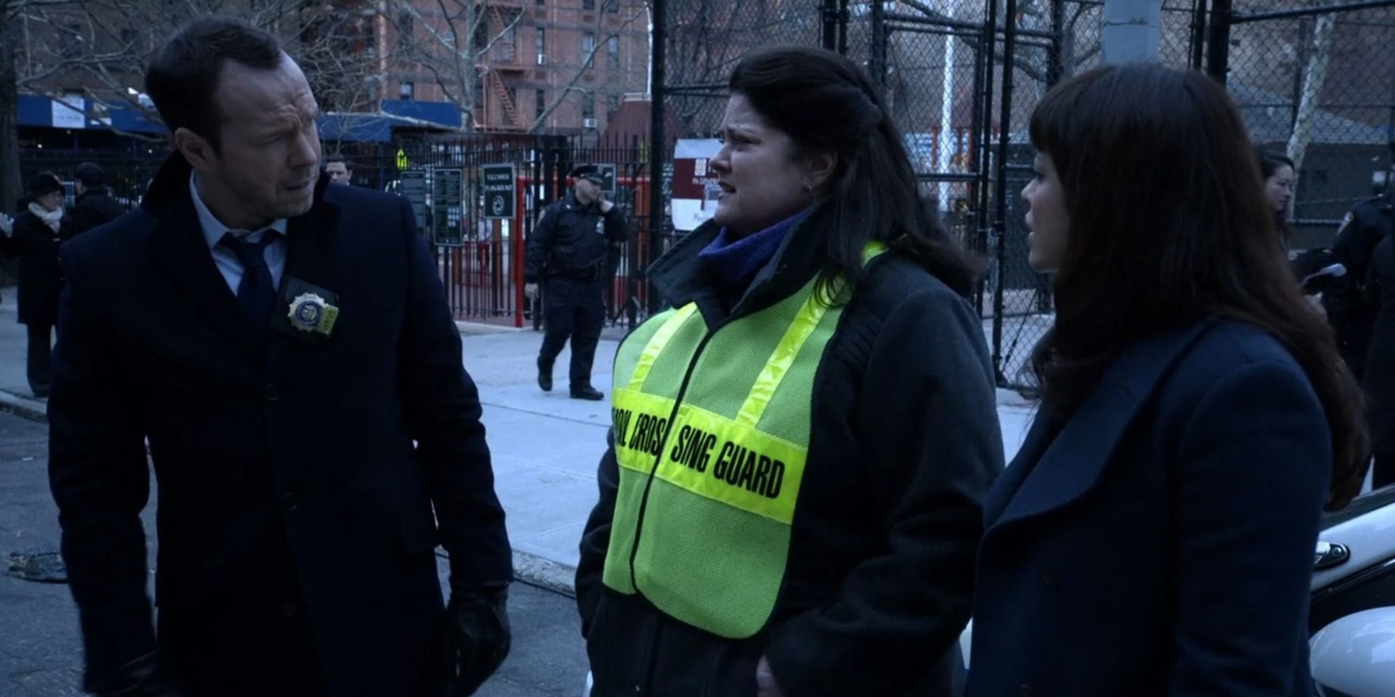 Danny (Donny Wahlberg) standing with officers in season 4 of Blue Bloods