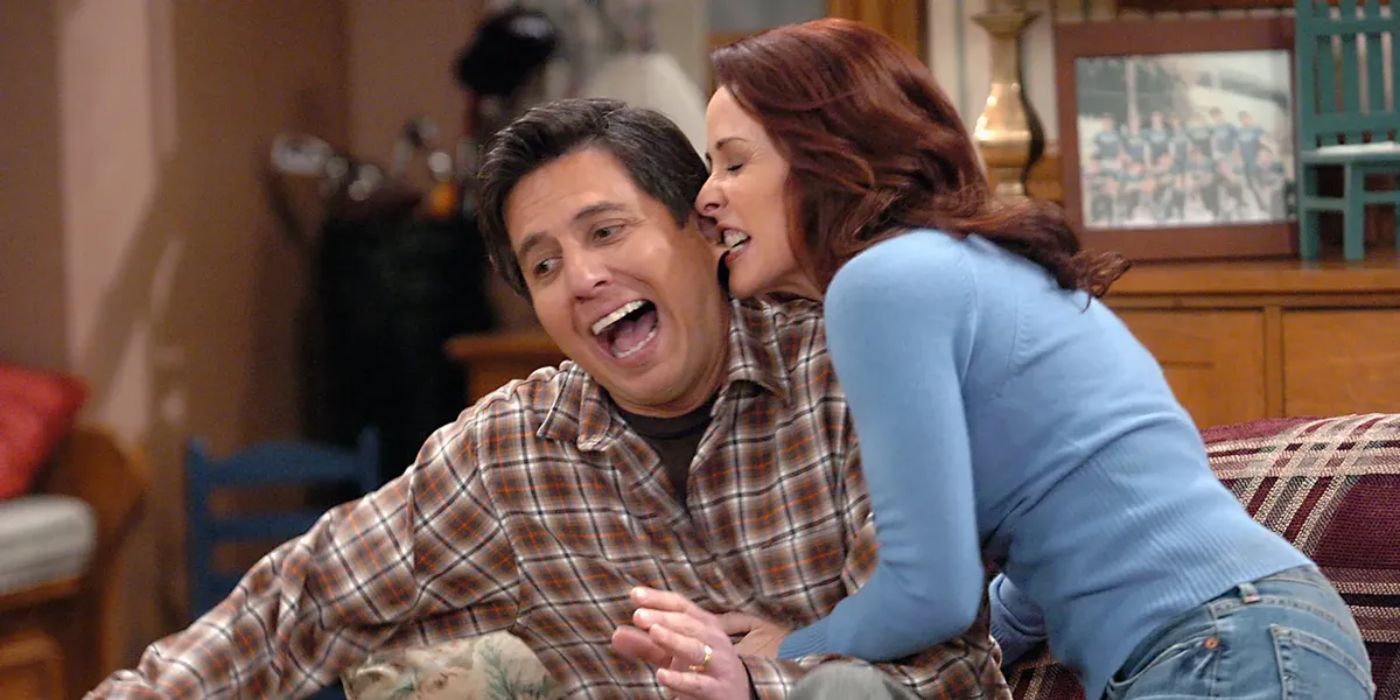 Debra biting Ray's ear in Everybody Loves Raymond