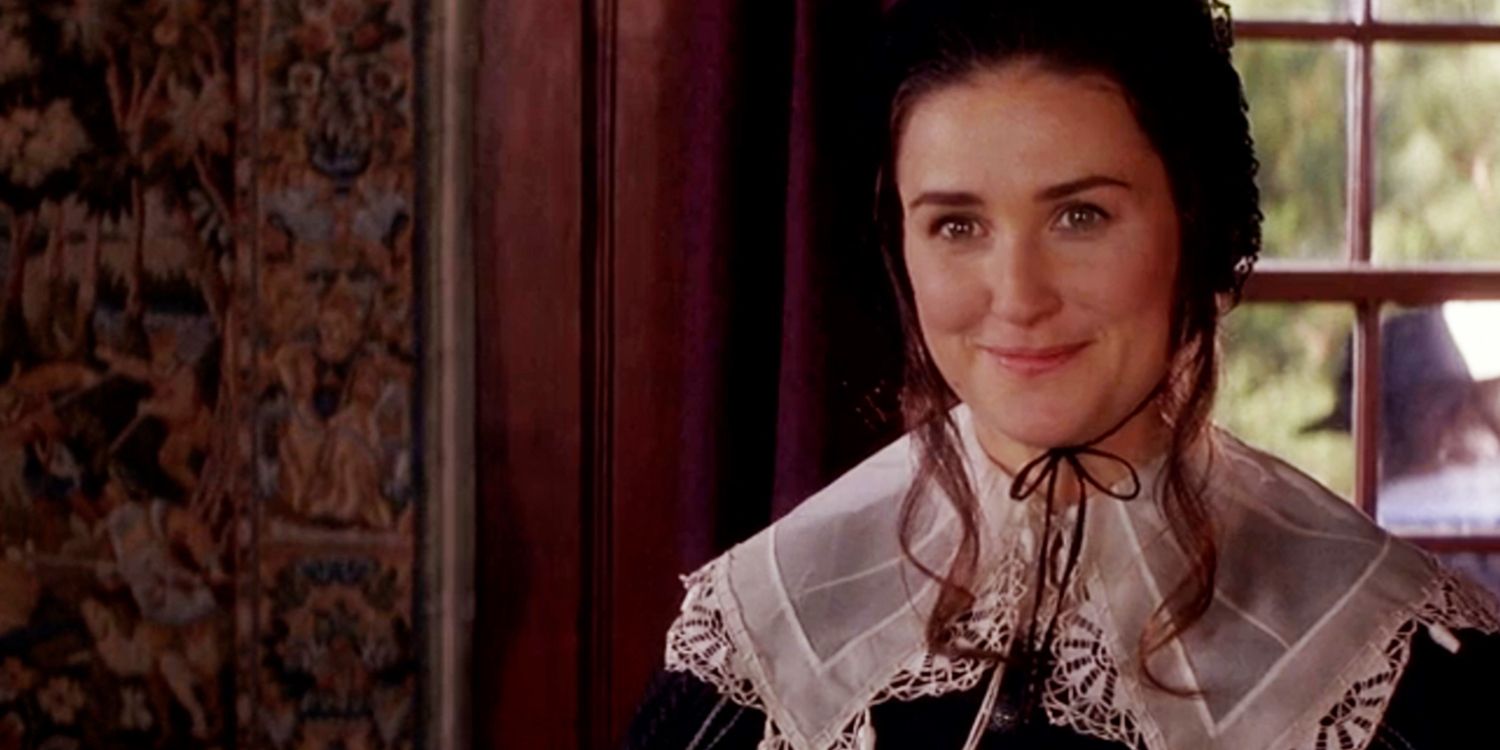 Demi Moore as Hester Prynne smiling playfully in The Scarlet Letter