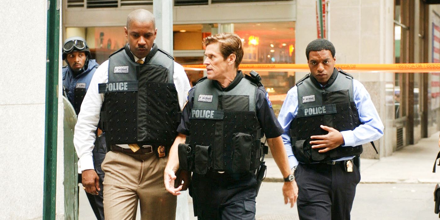 Detective Fraizer, Captain Darius, and Detective Mitchell walking in uniform in Inside Man