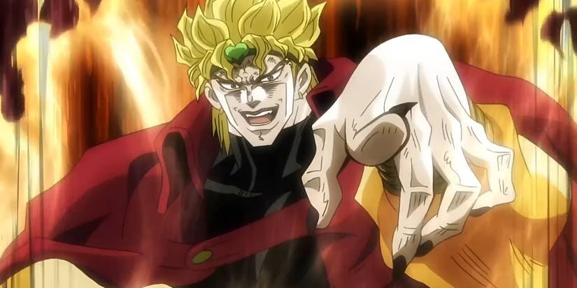 A man with spiky hair and a red cloak points his long nailed finger while smirking.