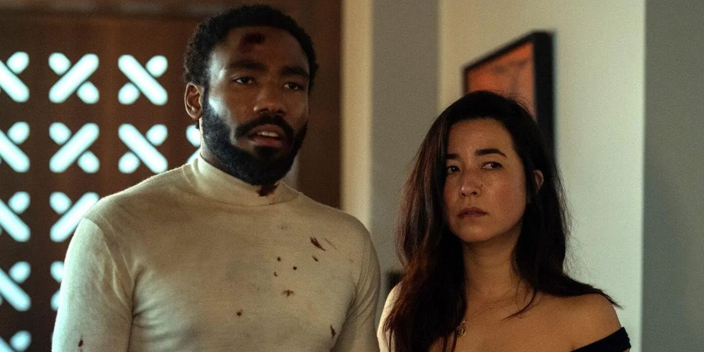 Donald Glover as John Smith with a bloody shirt with Maya Erskine as Jane Smith in Mr & Mrs Smith Show