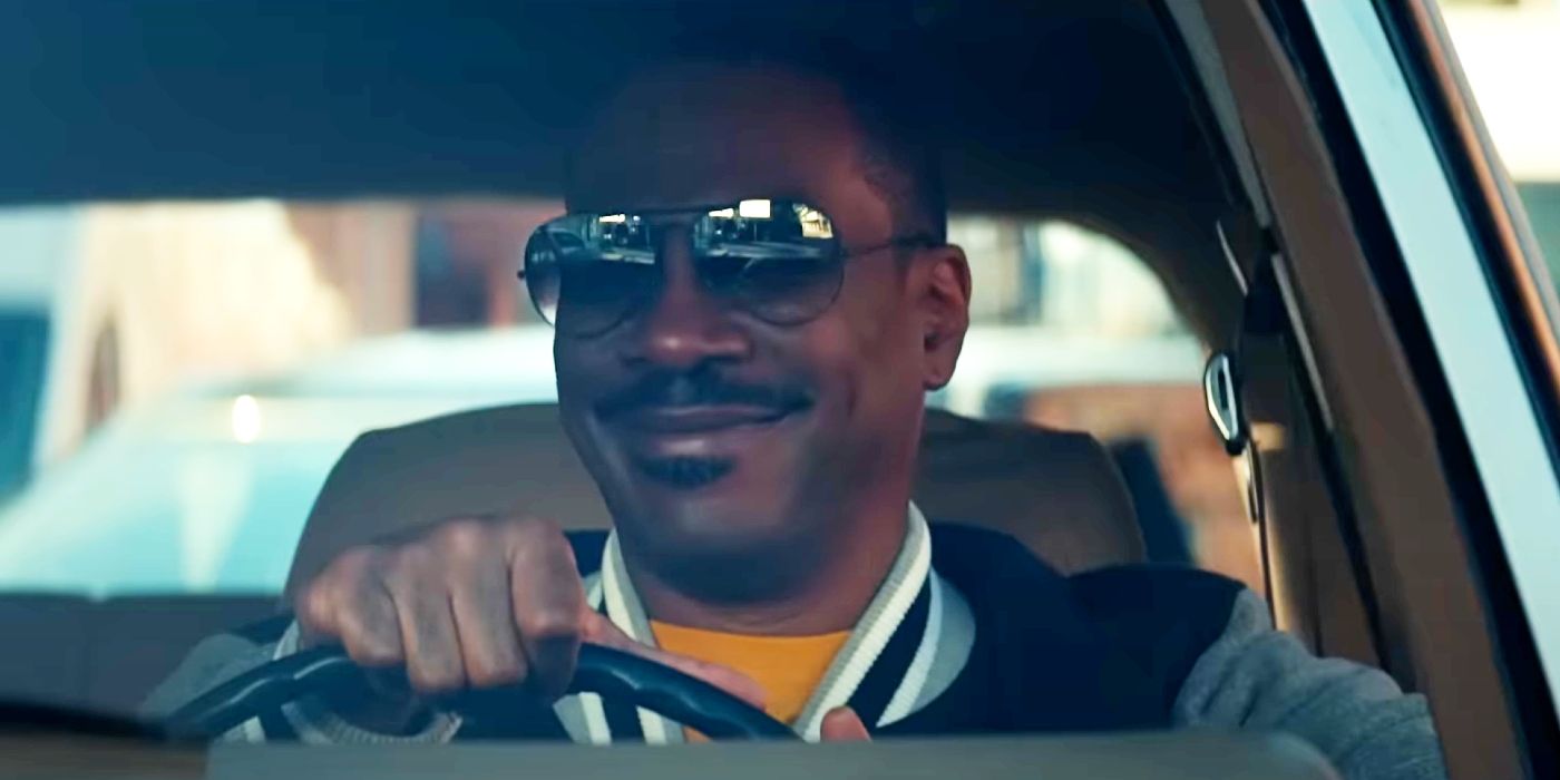 Eddie Murphy smiling behind the wheel of a car as Axel Foley in Beverly Hills Cop: Axel F