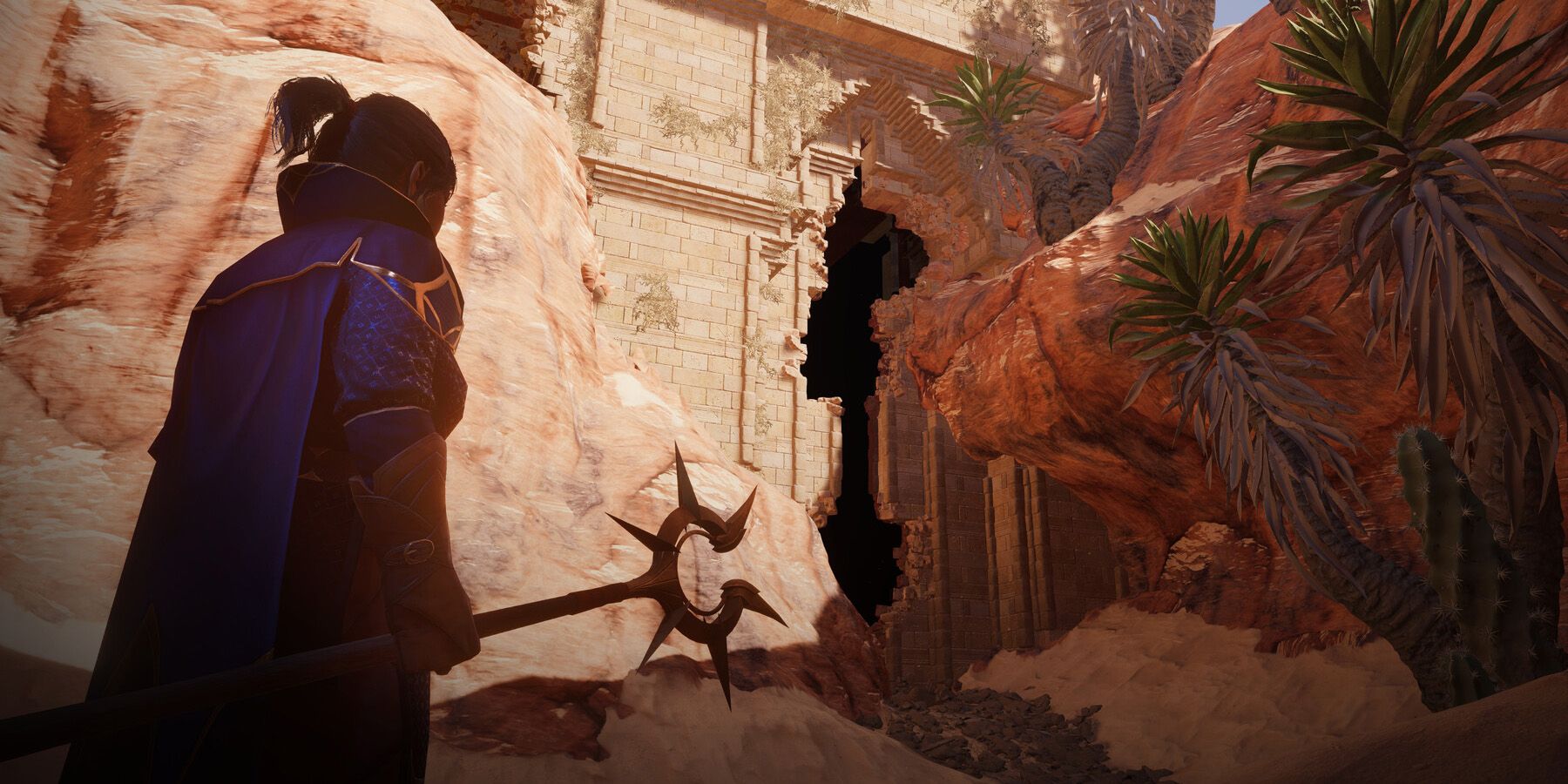 Enshrouded player standing near ruins in a desert landscape.