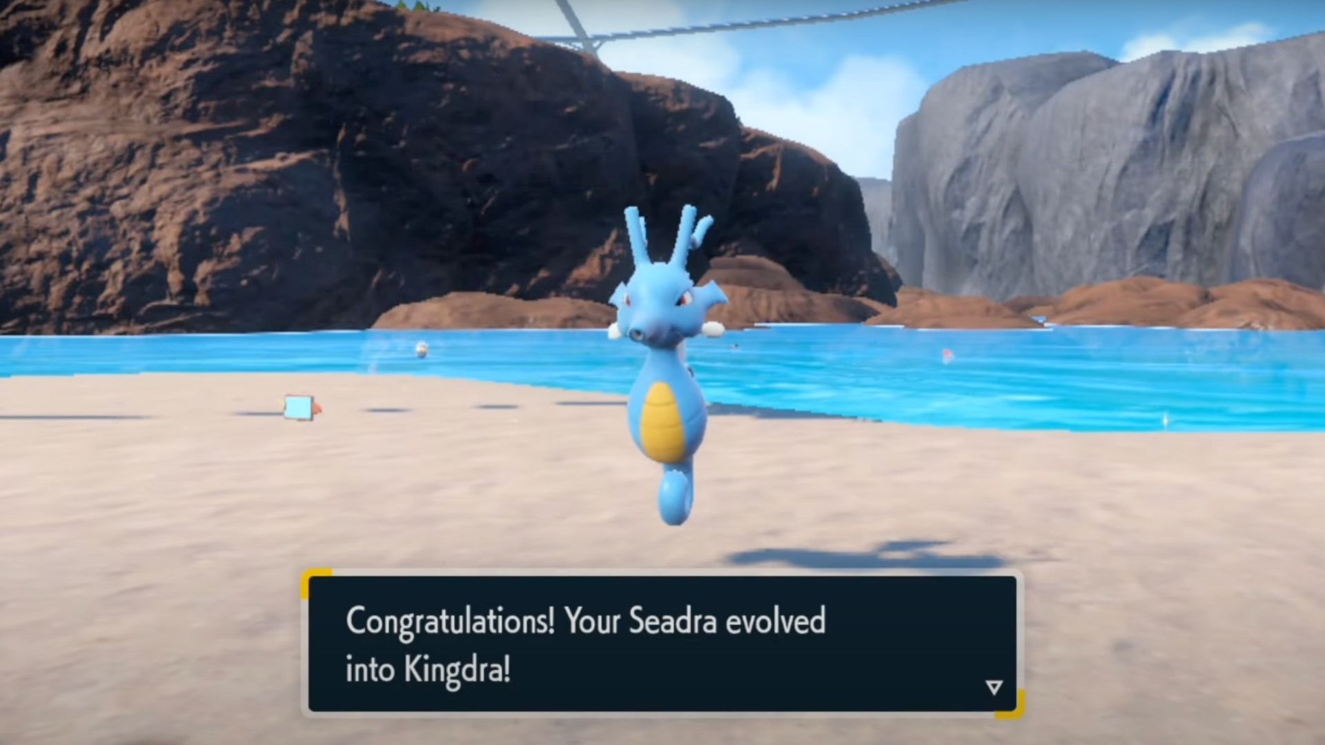 Evolved Kingdra with notification on screen in Pokemon Scarlet & Violet Indigo Disk DLC